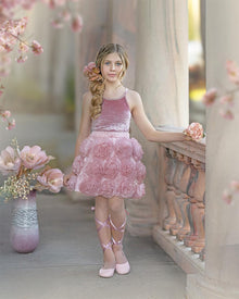 Girls blush pink velvet camisole top with rhinestone trim paired with matching blush pink skirt with flower details styled for a special occasion