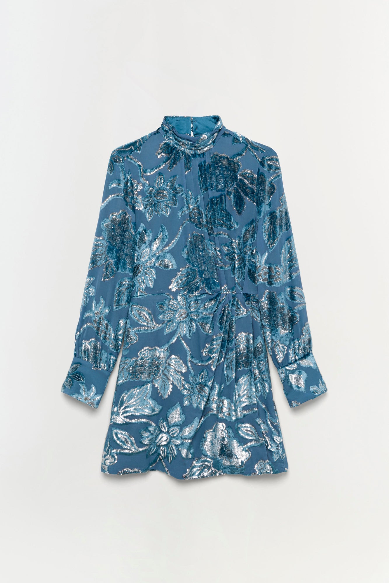 Blue mini dress with silver leaf print, long sleeves, gathered neckline, and gathered waist detail.