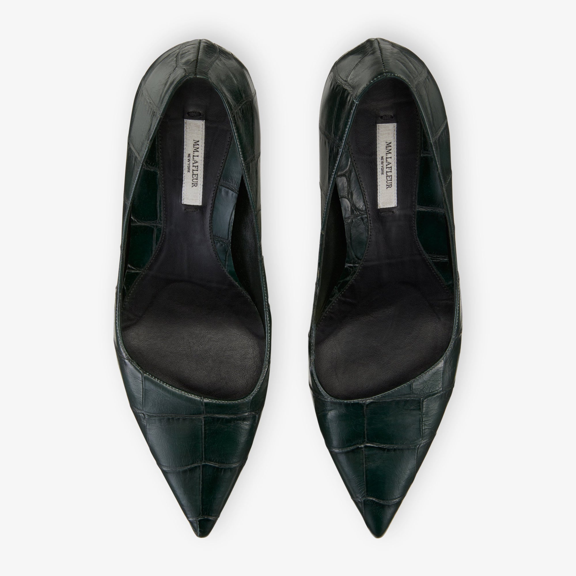 still image of the ginger pump in green croc 