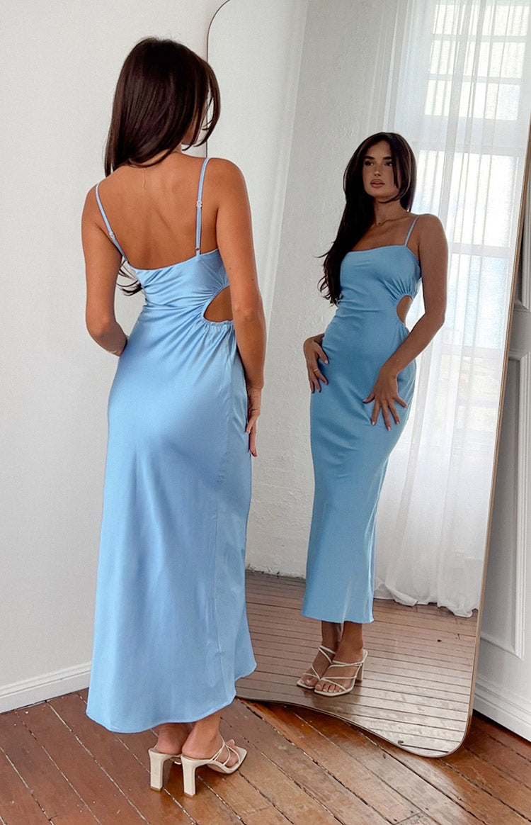 Rear view of a light blue maxi dress with thin spaghetti straps, low scoop back, and side cutouts