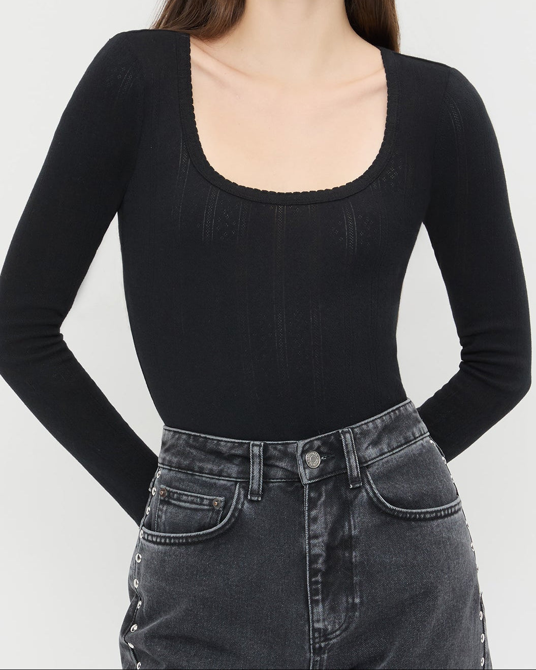 Kaya Pointelle Long-Sleeve Bodysuit in black and Winona Denim Barrel Pant in washed black.