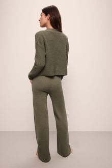 Model is Wearing the Recycled Sweater Cropped Cardigan in Moss.