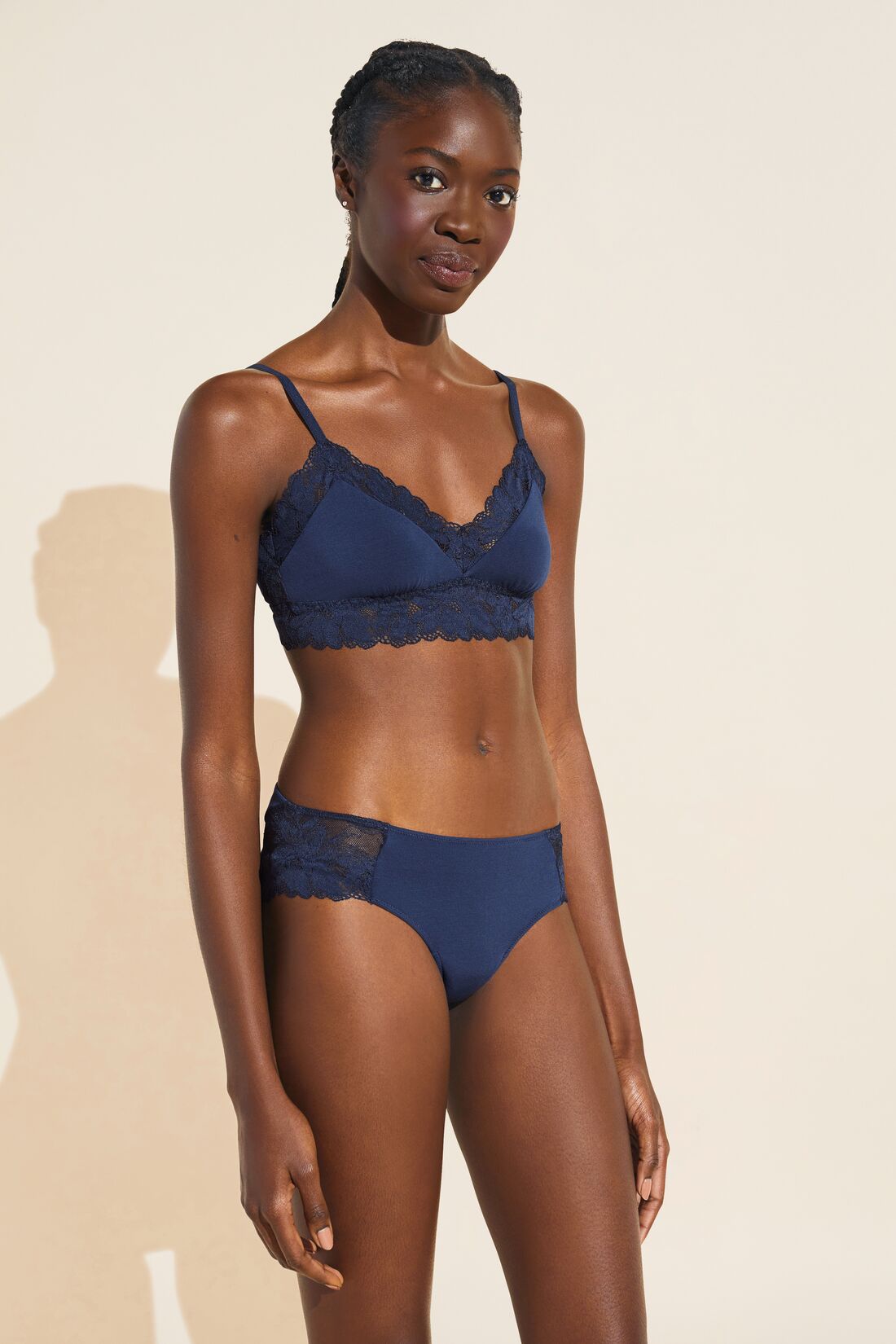 Model wears Rosalia TENCEL Modal Bralette in Navy.