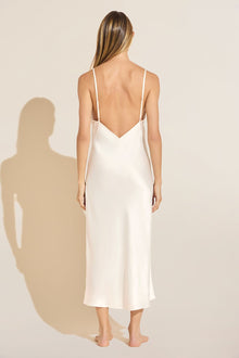 Model wears Inez Washable Silk Slip Dress in Ivory.