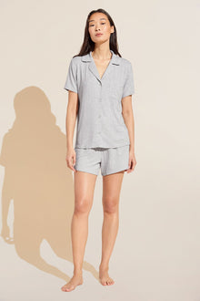 Model wears Gisele TENCEL Modal Rib Relaxed Short PJ Set in light heather grey.