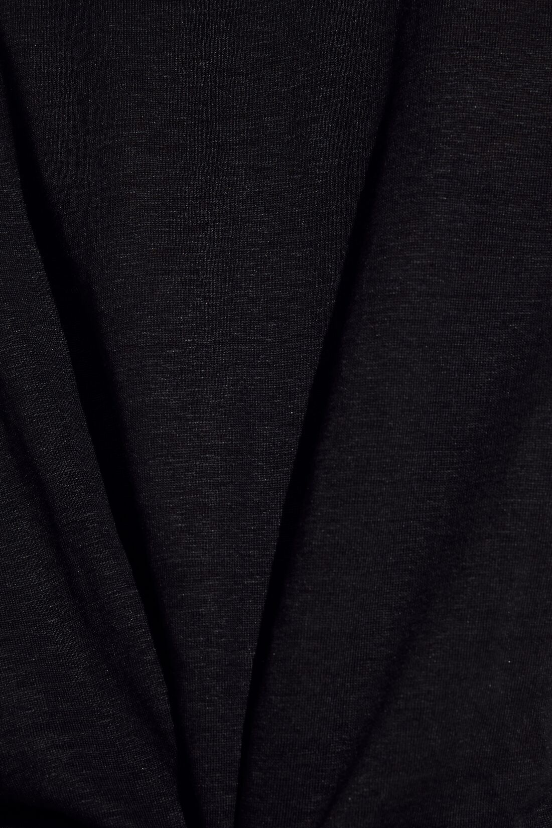 Model wears Organic Linen Knit Short Sleeve T-Shirt in Black.