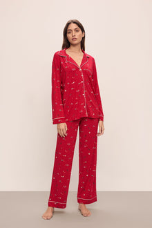 Model wears the Gisele Printed TENCEL Modal Long PJ Set in Winter Wonderland Haute Red/Ivoryory.
