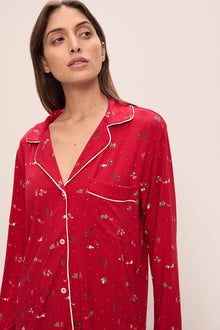Model wears the Gisele Printed TENCEL Modal Long PJ Set in Winter Wonderland Haute Red/Ivoryory.