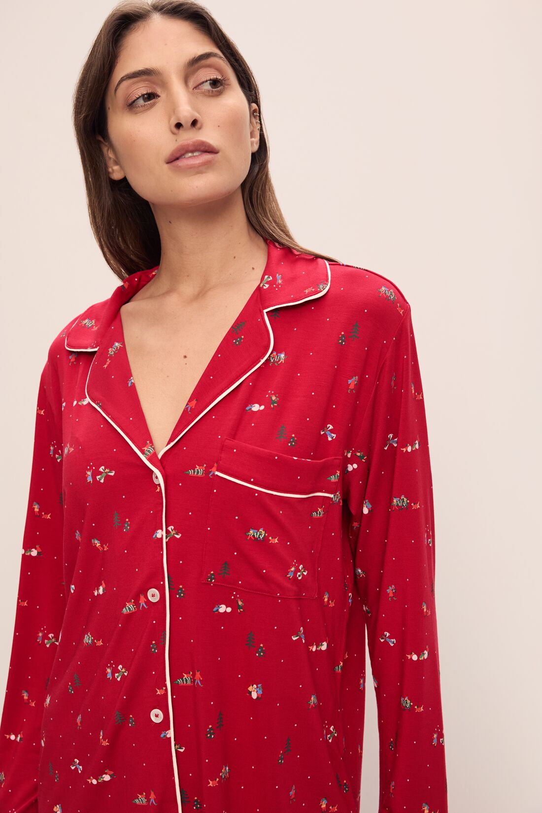 Model wears the Gisele Printed TENCEL Modal Long PJ Set in Winter Wonderland Haute Red/Ivoryory.