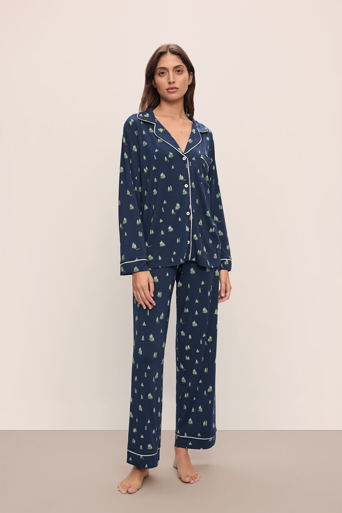 Model wears the Gisele Printed TENCELâ„¢ Modal Long PJ Set in Woodland Pine Navy/Ivory.