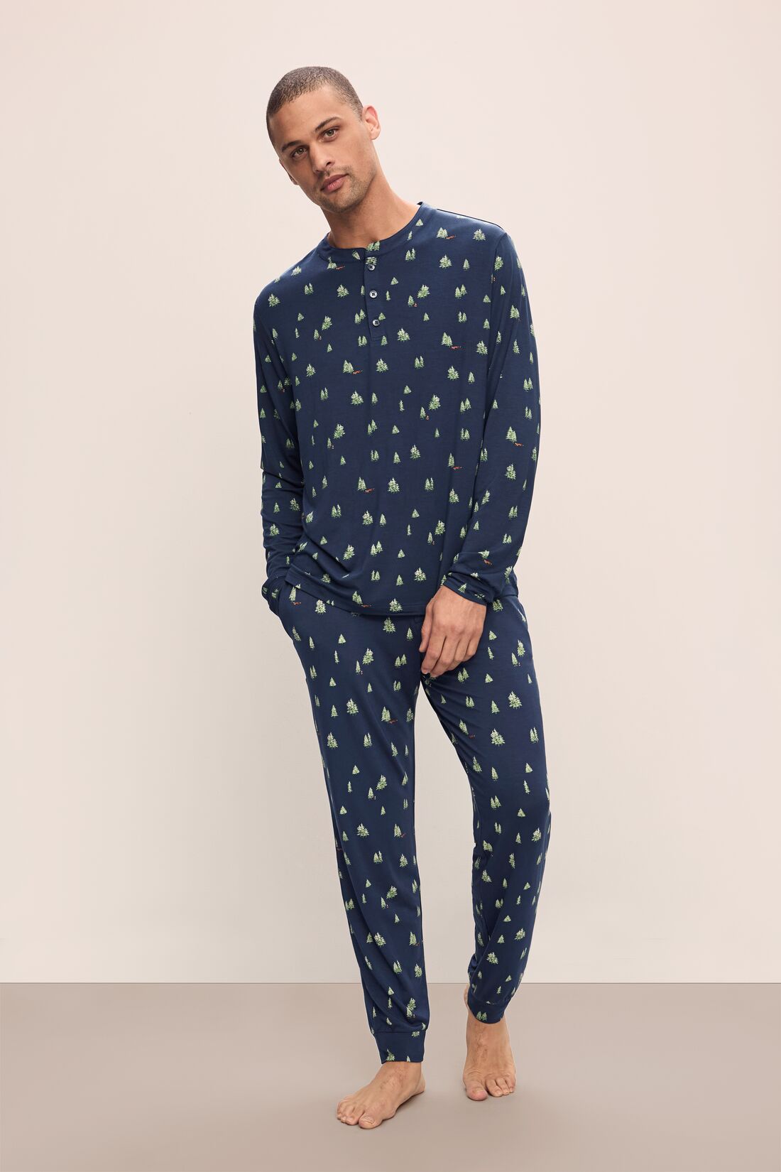 Model wears Henry Printed TENCEL Modal Long PJ Set in Woodland Pine Navy/Ivory.