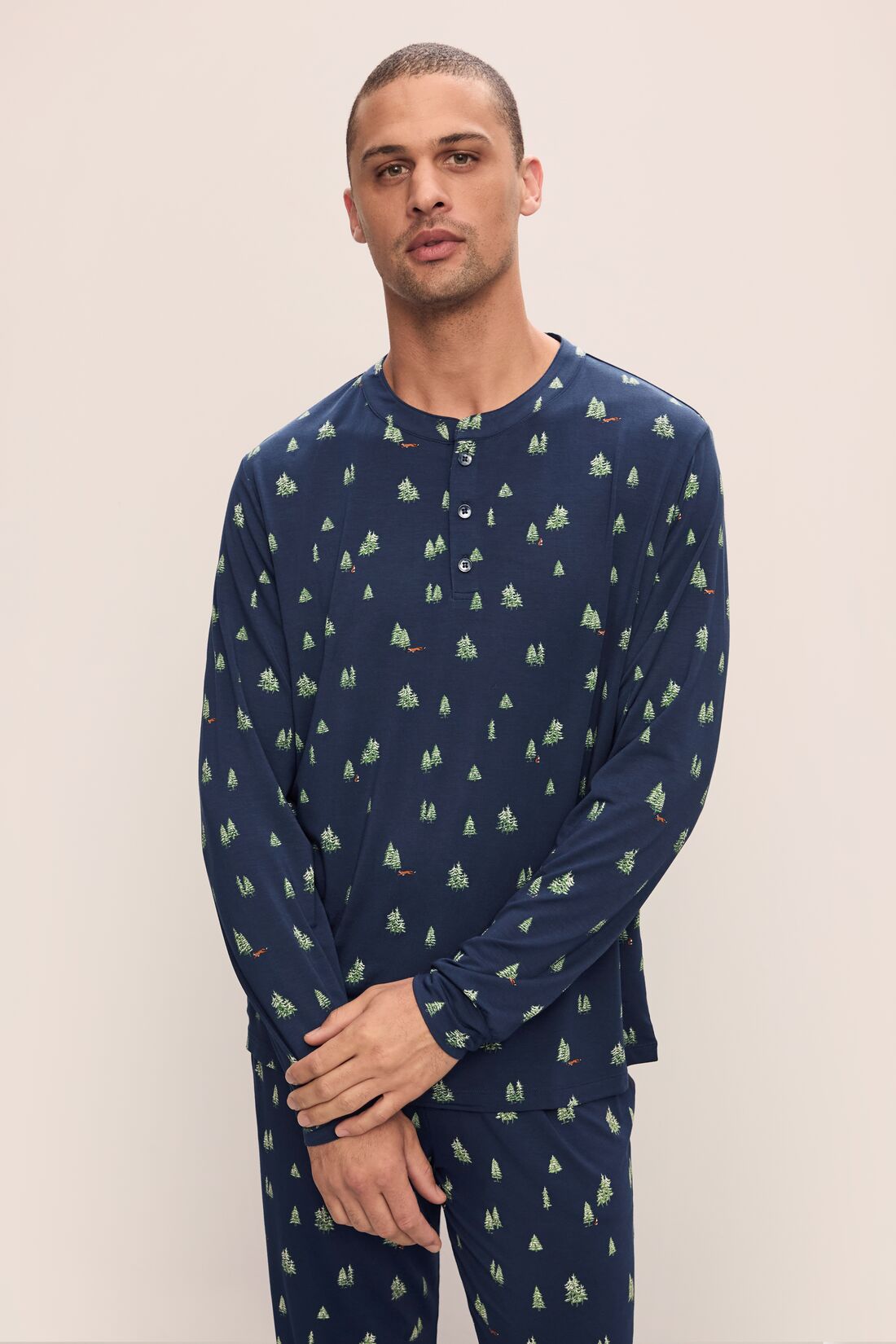 Model wears Henry Printed TENCEL Modal Long PJ Set in Woodland Pine Navy/Ivory.