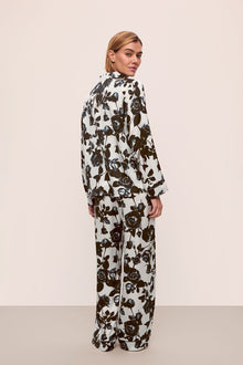 Model is wearing Inez Washable Silk Printed Long PJ Set in Rose Memoire Pearl/Black