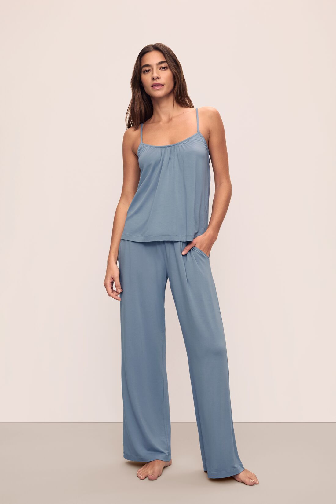 Model is wearing Gisele TENCEL Modal Cami & Pant PJ Set in Faded Denim