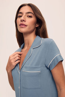 Model is wearing Gisele TENCEL Modal Short Sleeve Cropped PJ Set in Faded Denim/Ivory
