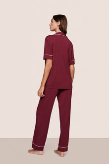 Model is wearing Gisele TENCEL Modal Short Sleeve & Pant PJ Set  in Bordeaux/Ivory