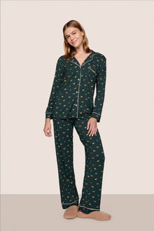 Model is wearing Gisele Printed TENCEL Modal Long PJ Set in Holiday Dog Pine/Ivory