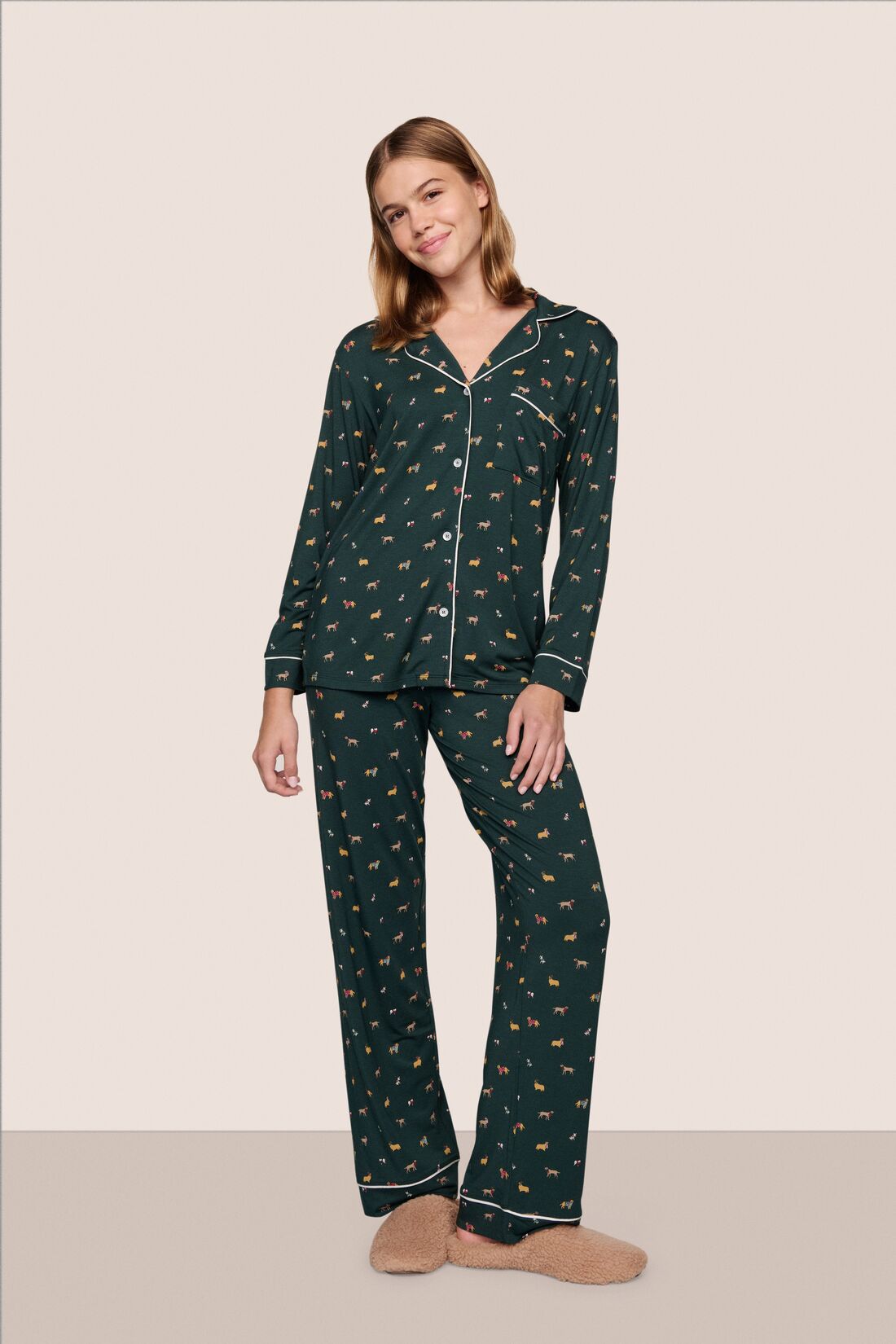 Model is wearing Gisele Printed TENCEL Modal Long PJ Set in Holiday Dog Pine/Ivory