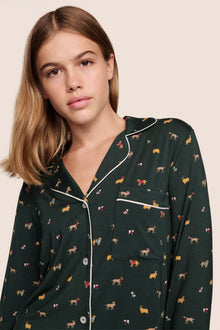 Model is wearing Gisele Printed TENCEL Modal Long PJ Set in Holiday Dog Pine/Ivory