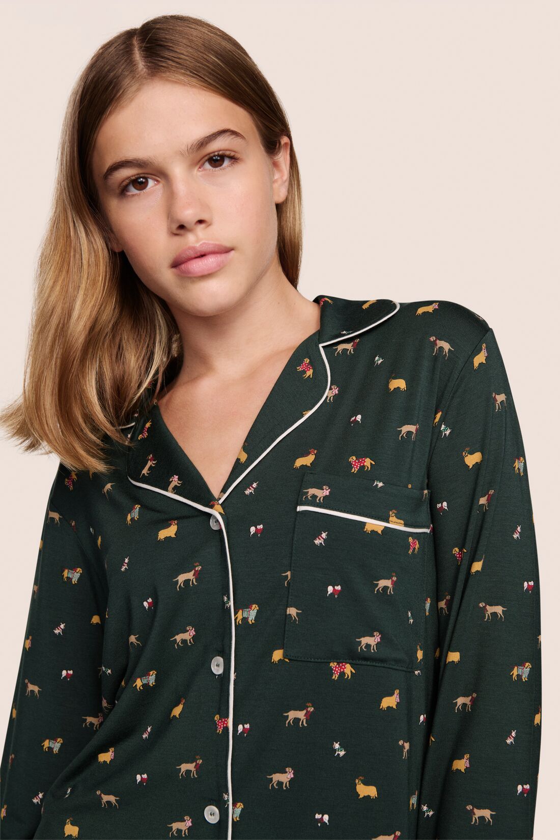 Model is wearing Gisele Printed TENCEL Modal Long PJ Set in Holiday Dog Pine/Ivory