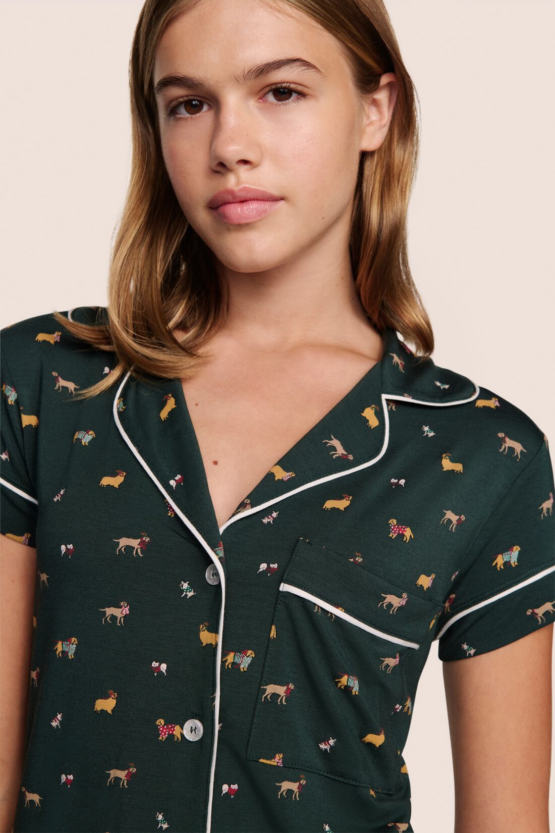 Model is wearing Gisele Printed TENCEL Modal Shortie Short PJ Set in Holiday Dog Pine/Ivory