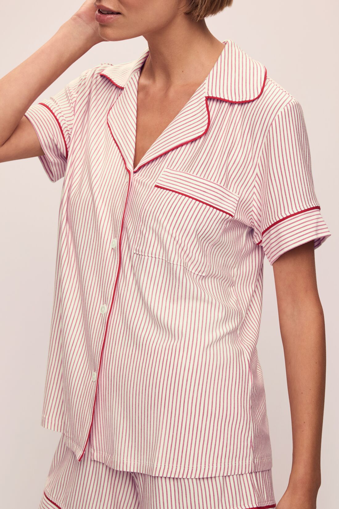 Model wears the Gisele Printed TENCELâ„¢ Modal Shortie Short PJ Set in Duo Stripe Haute Red/Haute Red.