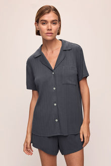 Model wears Gisele TENCEL Modal Rib Relaxed Short PJ Set in Graphite.
