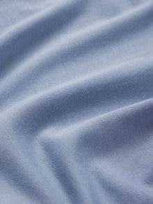 Model wears Gisele TENCELâ„¢ Modal Relaxed Short PJ Set in wedgewood blue/ivory.