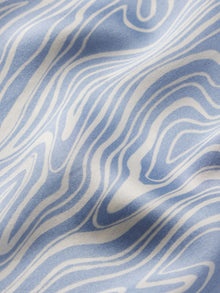 Model wears Inez Washable Silk Printed Short PJ Set in Malachite Wedgewood Blue/Ivory.