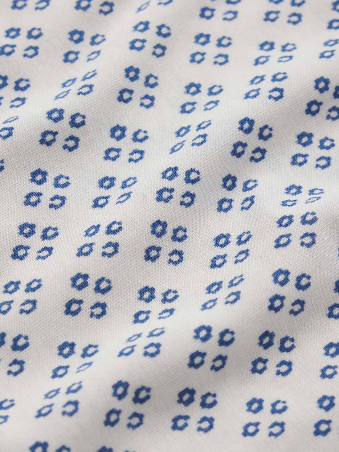 Model wears Gisele TENCEL Printed Modal Ruffle Cami & Shortie Short Set in Petite Batik Ivory/Denim Blue.