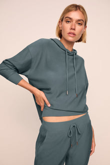 Model is wearing softest sweats hoodie in stone blue