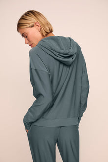 Model is wearing softest sweats hoodie in stone blue
