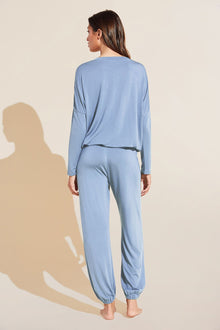 Model wears Gisele TENCELâ„¢ Modal Slouchy PJ Set in wedgewood blue/ivory.