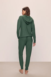 Model wears Softest Sweats Jogger in Spruce.