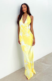 Close-up of the deep V-neckline on a yellow and white patterned dress
