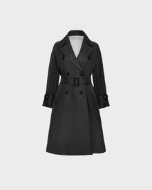 The MIRELLE - 8124055 Black by Rudsak is a womens classic knee-length trench coat with a tailored fit, belted waist, double-breasted buttons, and lapel collar—ideal for versatile looks. Shown on a plain light background.