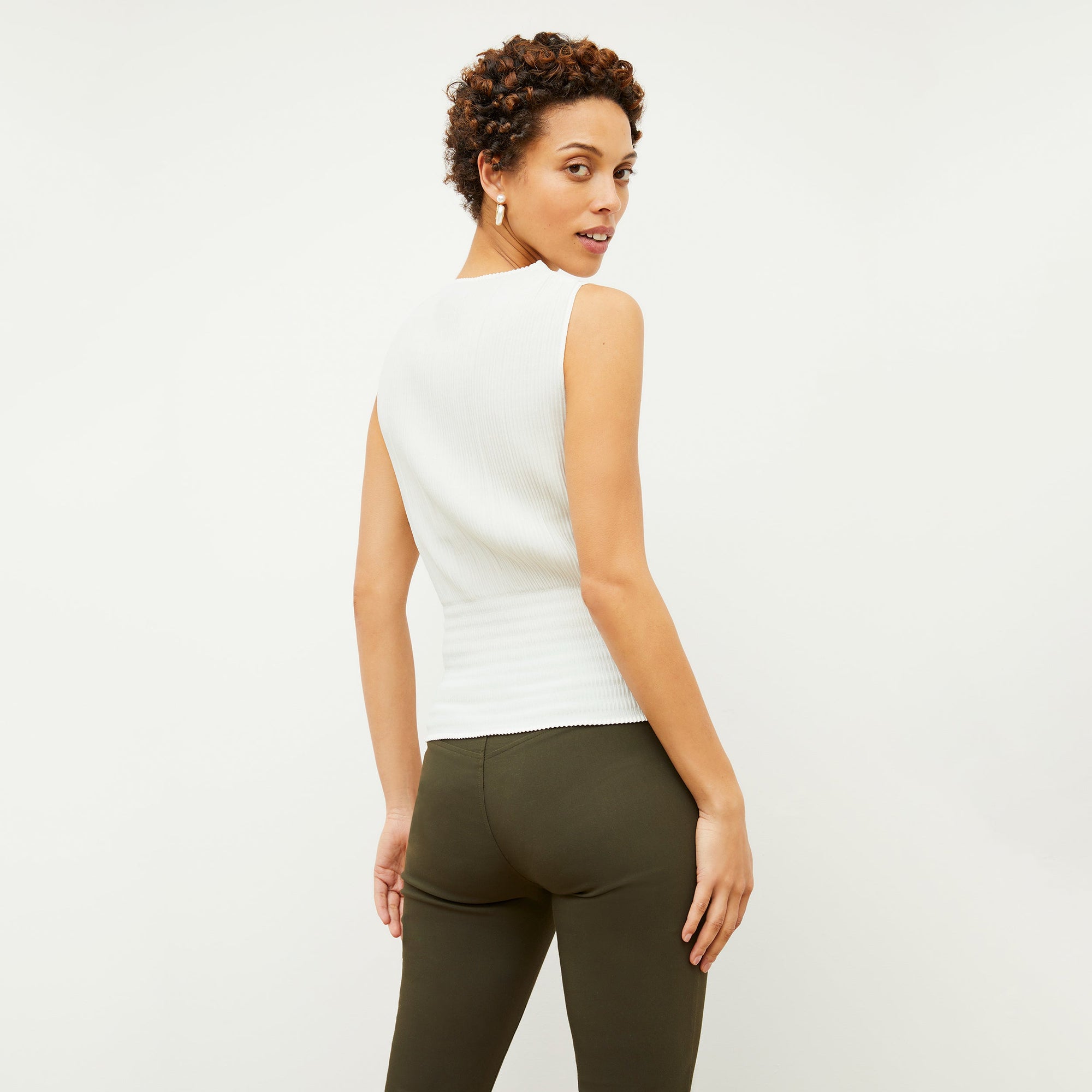 back image of woman wearing foster pant in dark olive | Exclude