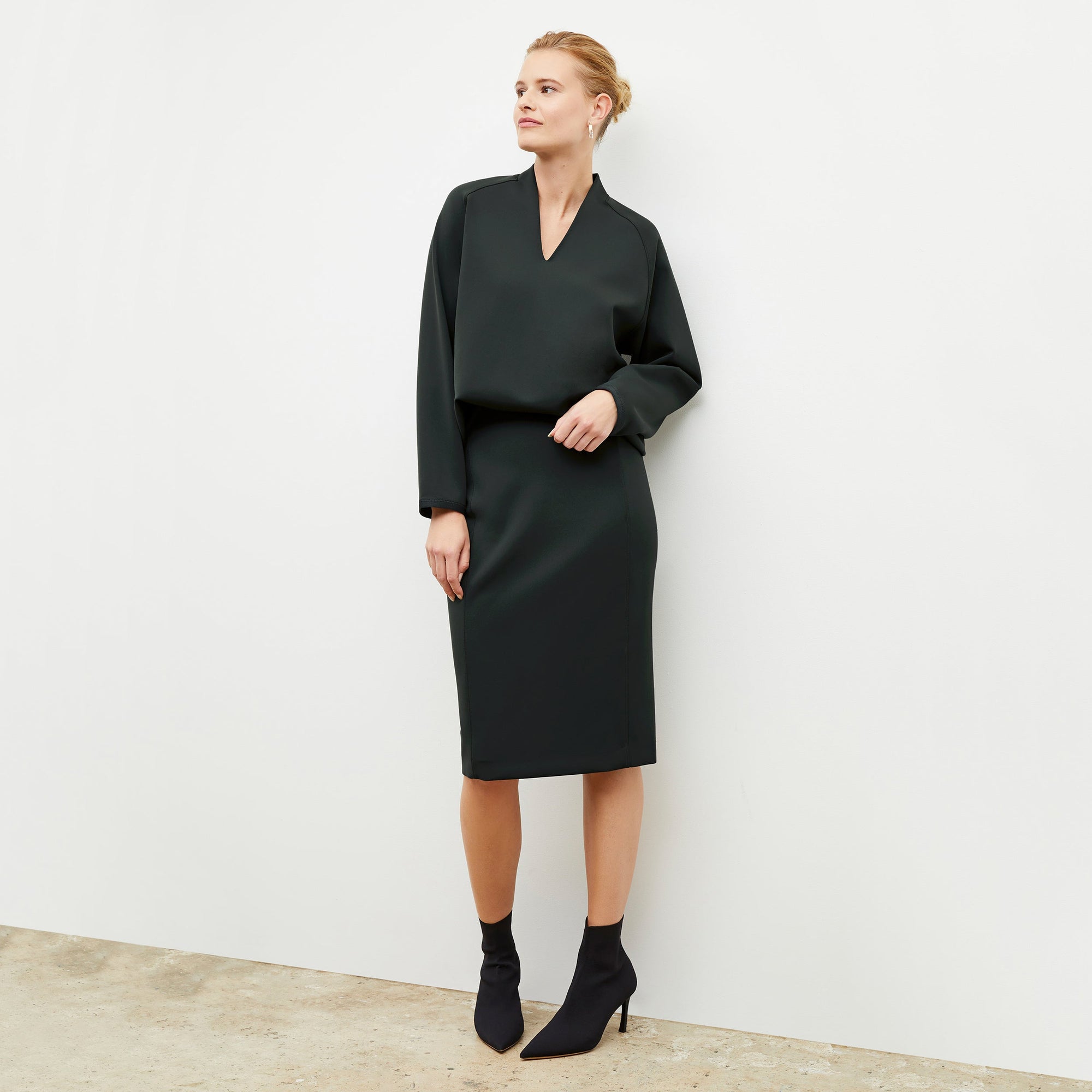 Image of a woman wearing the Chantal Skirt - Light Scuba in Forest