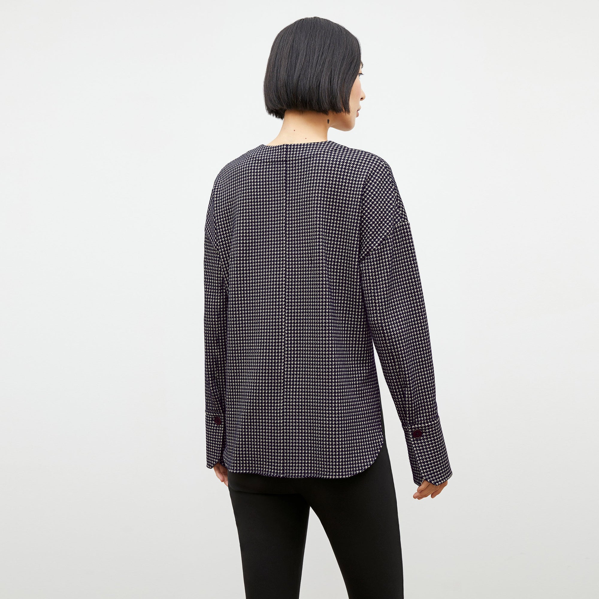 Back image of a woman wearing the tully top in black and white