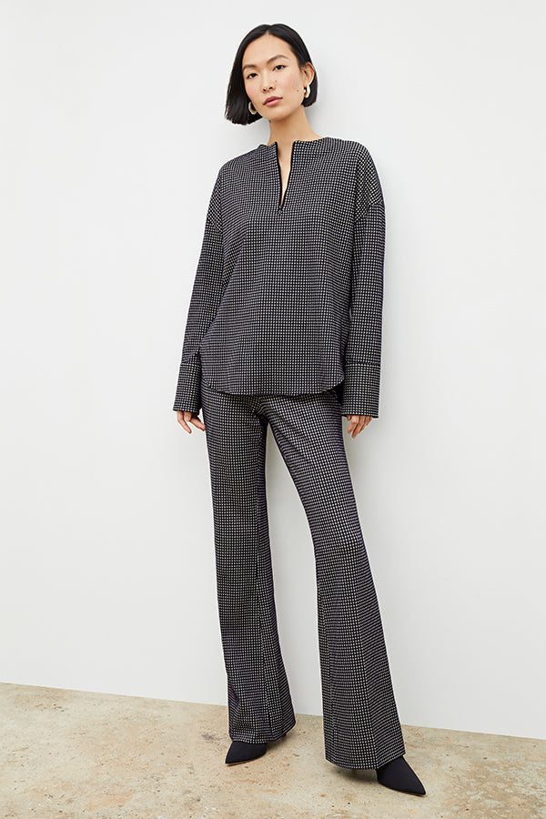 Front image of a woman wearing the horton pant in black and white houndstooth | Exclude