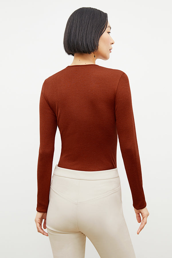 Back image of a woman standing wearing the foster pant in bone | Exclude