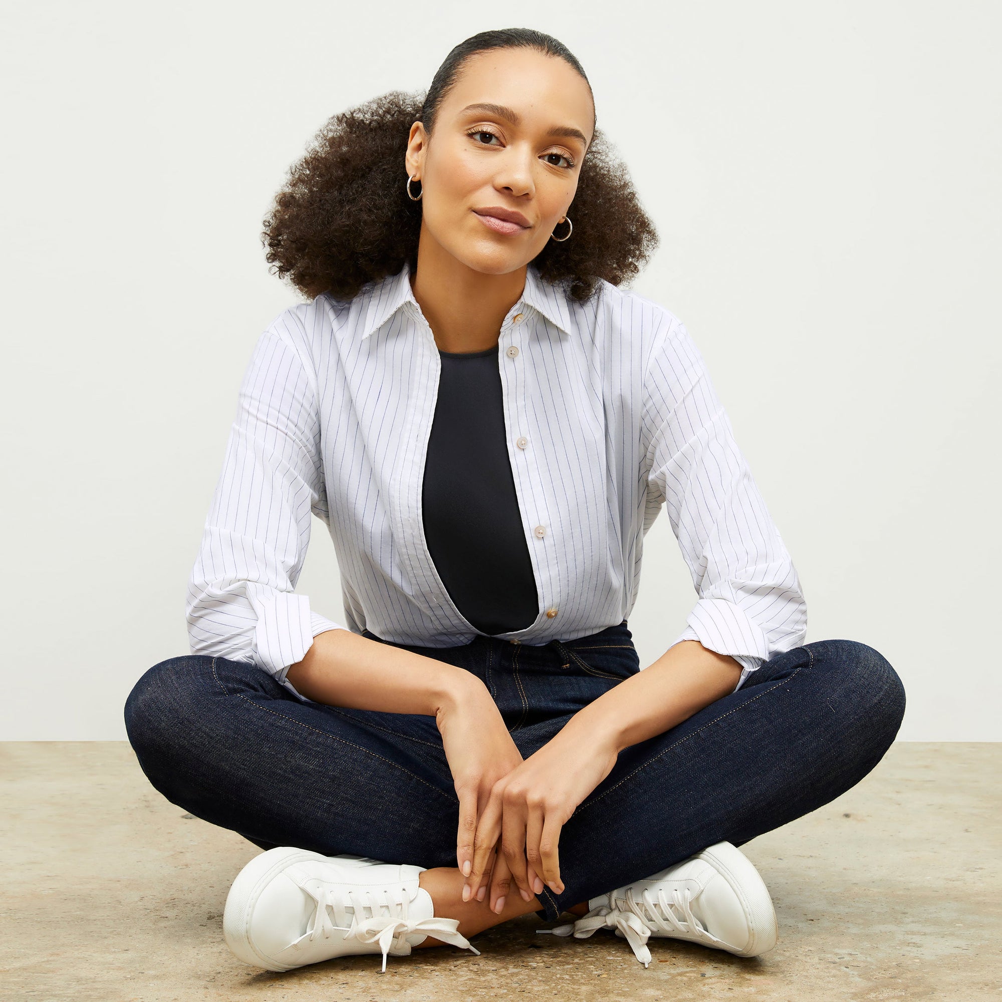 Front image of a woman wearing the Mila Button Down - Poplin Stripe in Blue / Ivory