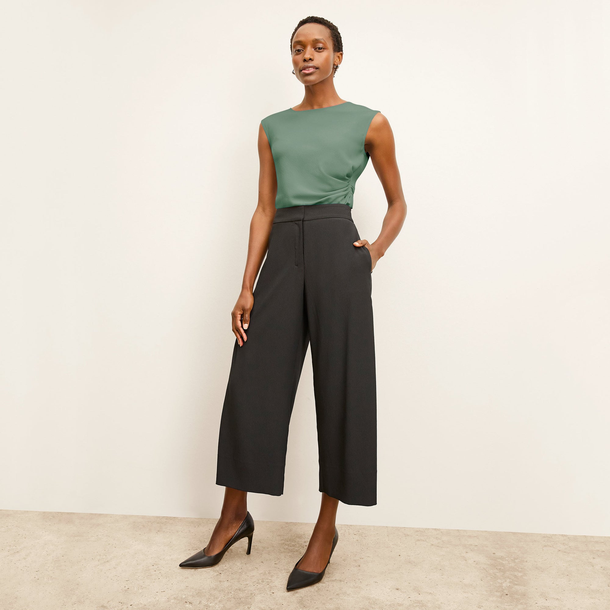 Front image of a woman standing wearing the Zhou culotte in black | Exclude