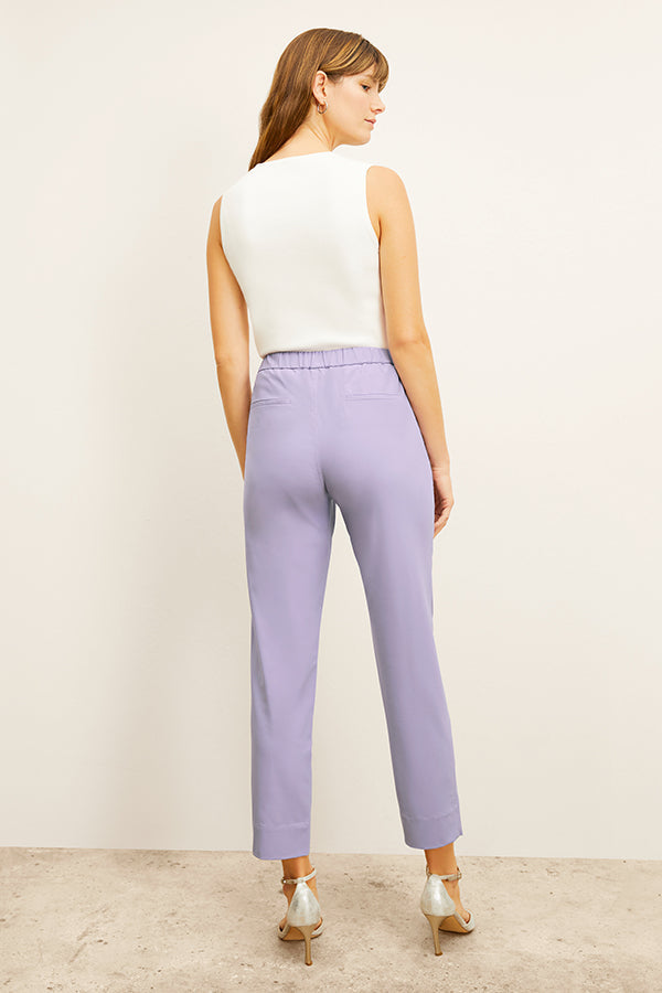 front image of a woman wearing the colby pants in light orchid | Exclude 