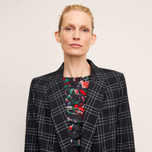 front image of a woman wearing the o'hara blazer in black/white