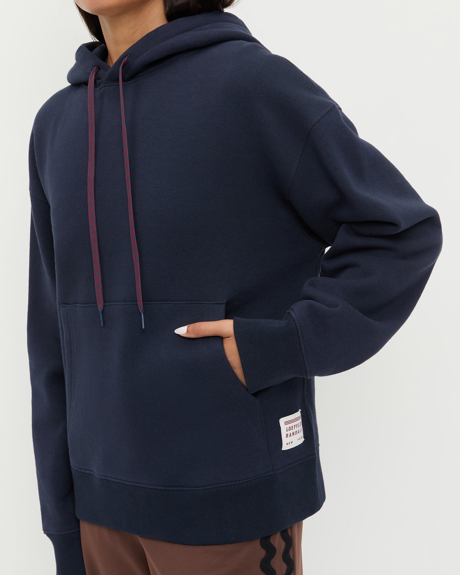 Nova Hoodie in navy cotton and Venus Track Pant in brown cotton.