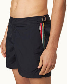 Shorter-Length Concealed OB Tape Swim Shorts In Night Iris Blue | Night Iris