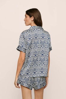 Model is wearing Inez Washable Silk Printed Short PJ Set in  Azulejos Navy/Navy
