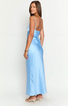 Side view of a light blue satin maxi dress with thin spaghetti straps and a tie-back detail