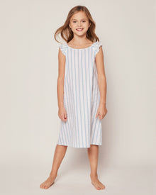 Blue and white striped dress with ruffled shoulders on a white background